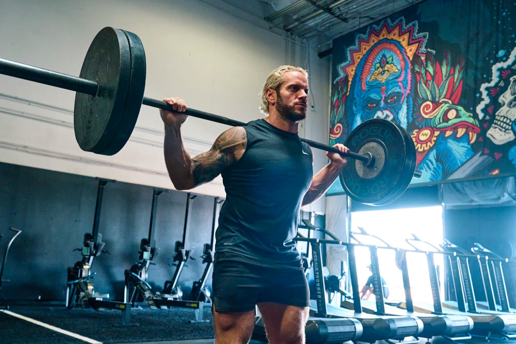 Jarred pressing a loaded barbell overhead